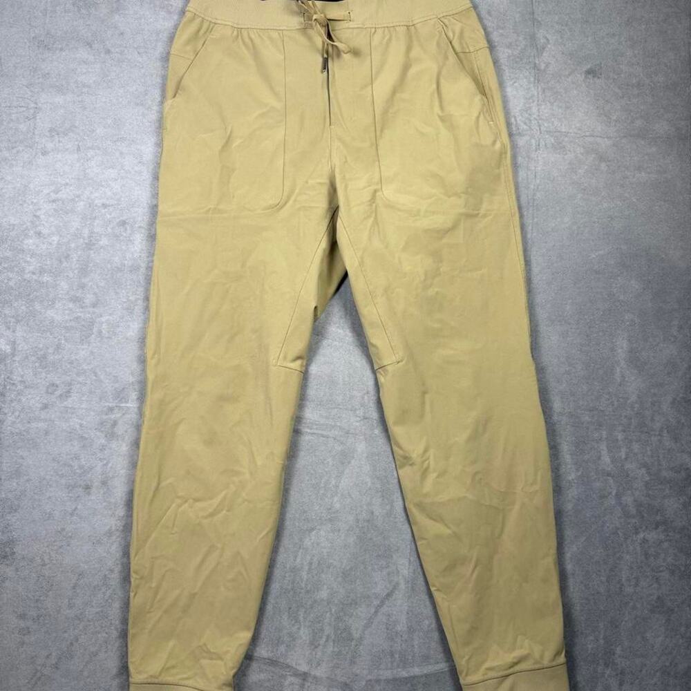 Men's LuluLemon khaki joggers with drawstring waist and tapered fit size large